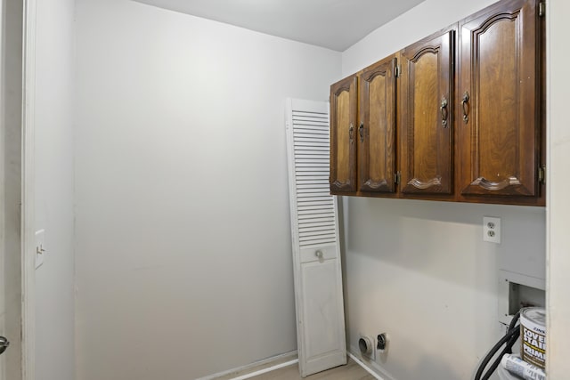 laundry area with cabinets and washer hookup