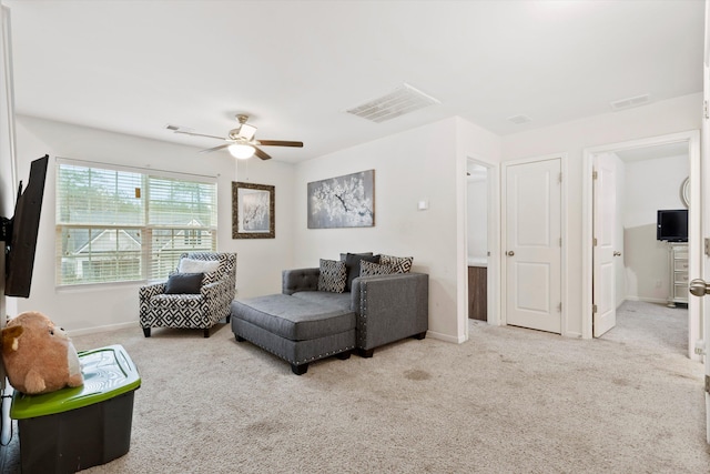 living area with visible vents, carpet flooring, and baseboards