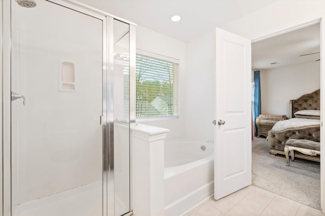 ensuite bathroom with tile patterned flooring, a shower stall, ensuite bathroom, and a garden tub