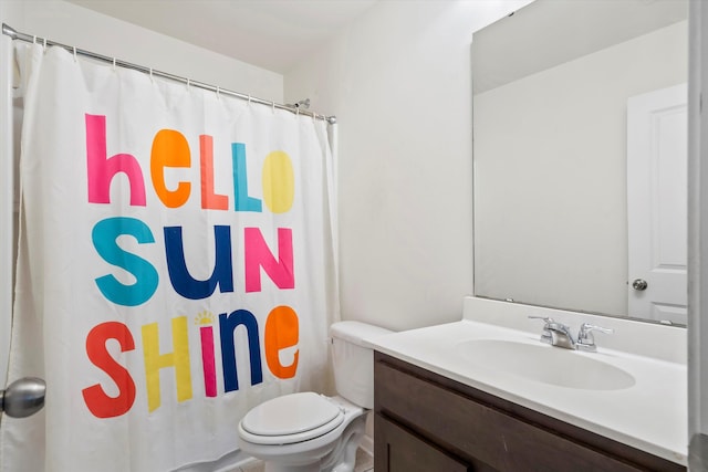 bathroom with a shower with shower curtain, toilet, and vanity