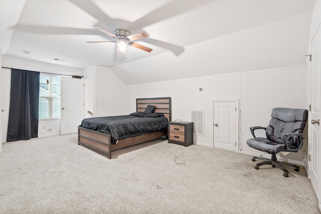 carpeted bedroom featuring vaulted ceiling, a ceiling fan, visible vents, and baseboards