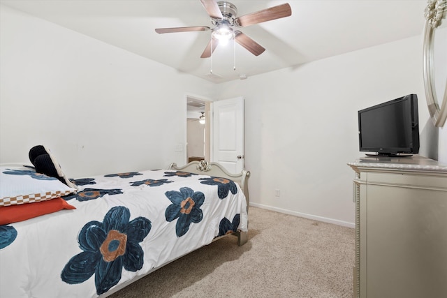 bedroom with baseboards, light carpet, and ceiling fan