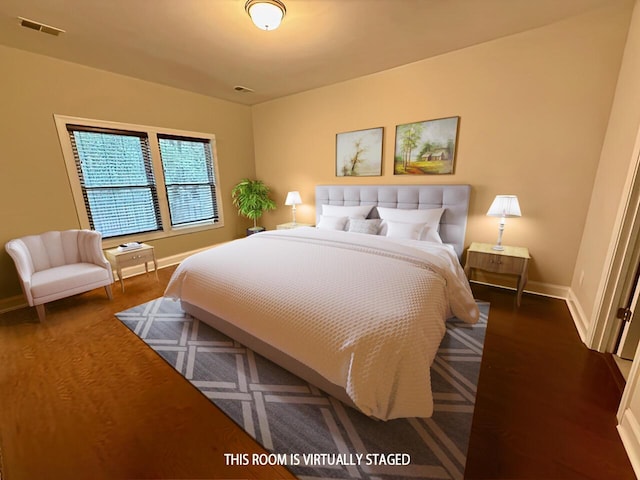 bedroom with visible vents and baseboards