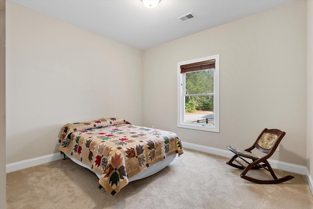 bedroom featuring baseboards, visible vents, and carpet flooring