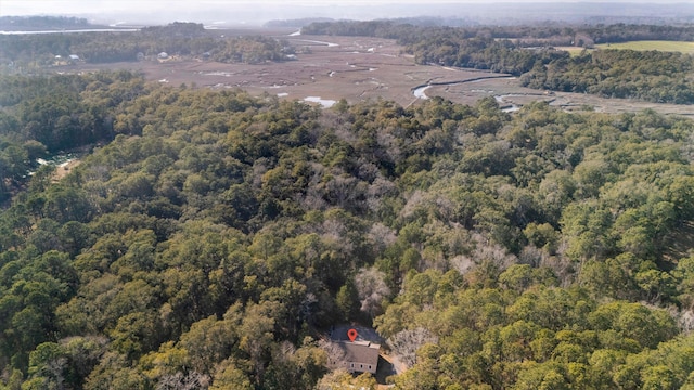 drone / aerial view featuring a forest view