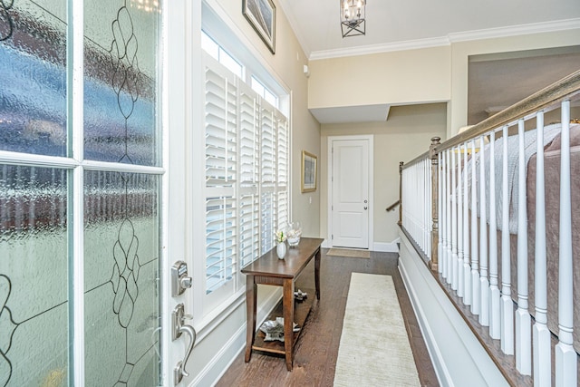 interior space featuring a chandelier, hardwood / wood-style floors, and ornamental molding