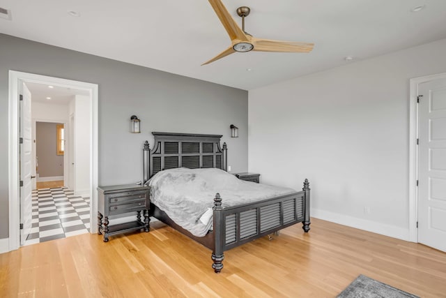 bedroom featuring hardwood / wood-style floors and ceiling fan