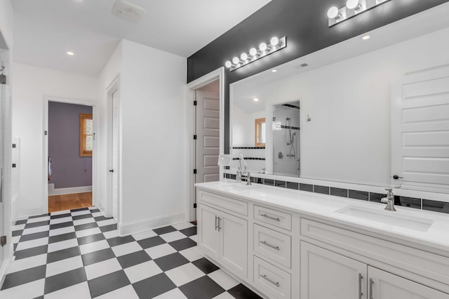 bathroom with vanity and a shower with shower door