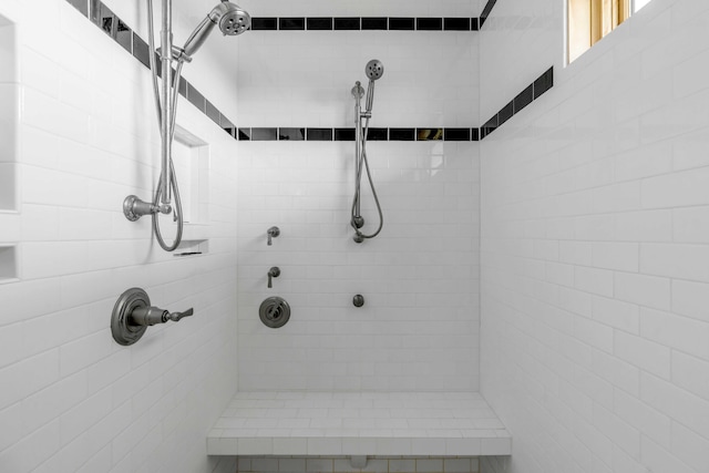 bathroom with a tile shower