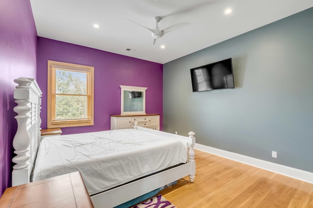 bedroom featuring ceiling fan and light hardwood / wood-style floors