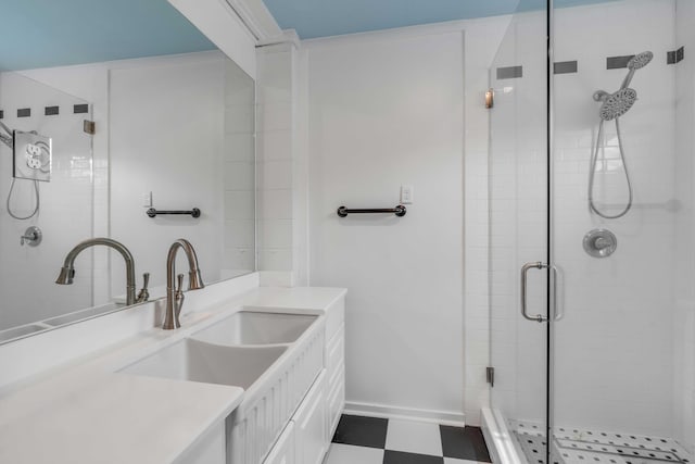 bathroom featuring vanity and a shower with shower door