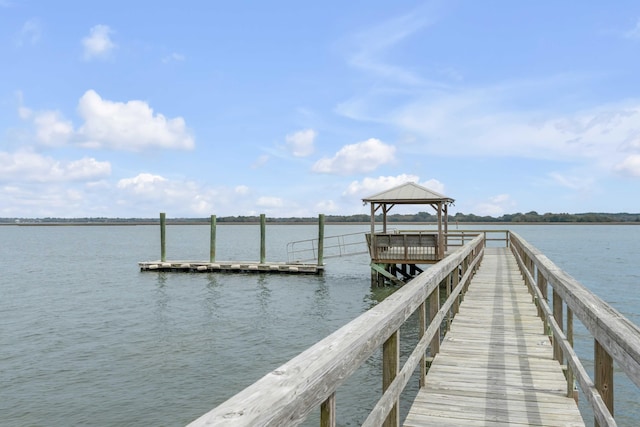 dock area featuring a gazebo and a water view