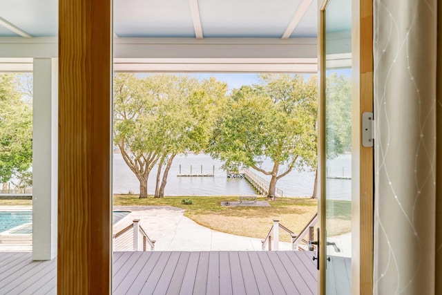 doorway to outside with a water view