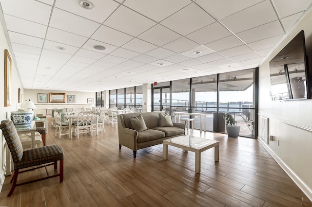 living room featuring dark hardwood / wood-style floors and floor to ceiling windows