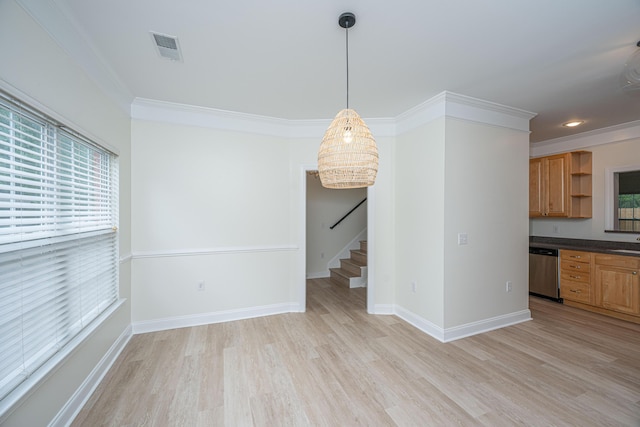 interior space featuring stairway, visible vents, plenty of natural light, and light wood finished floors