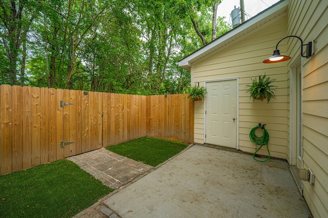 view of yard with fence and a patio
