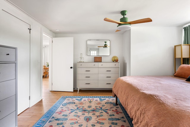 bedroom featuring light wood finished floors and a ceiling fan