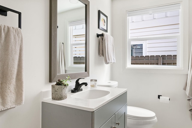 half bath with toilet and vanity