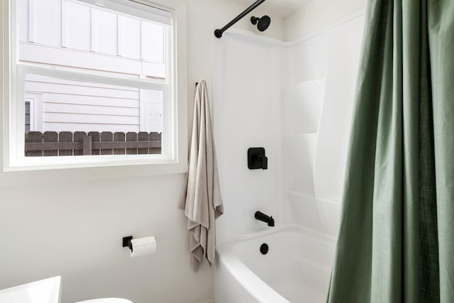 full bath featuring shower / bath combo and toilet