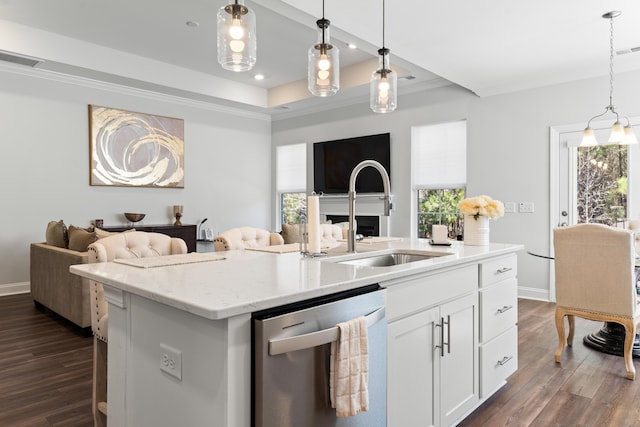 kitchen with dark wood finished floors, a sink, dishwasher, a raised ceiling, and open floor plan