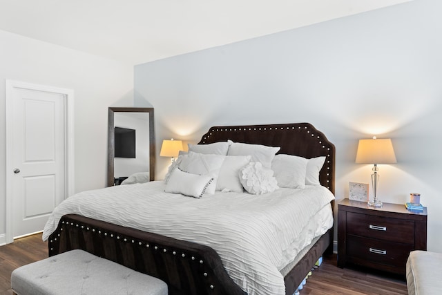 bedroom with wood finished floors