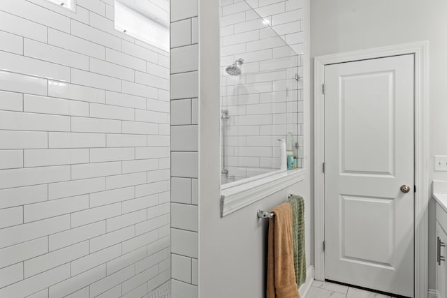 full bathroom with marble finish floor and walk in shower