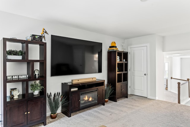 living area with light carpet