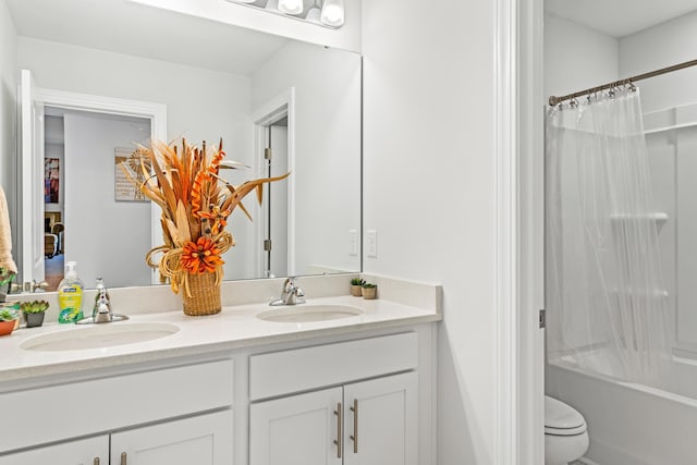 full bath with a sink, shower / tub combo with curtain, double vanity, and toilet