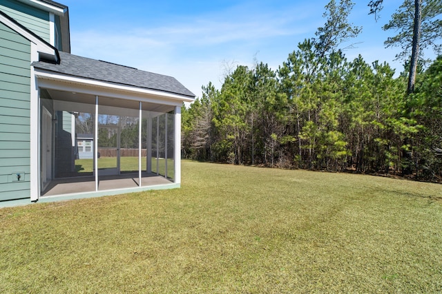 view of yard with a sunroom