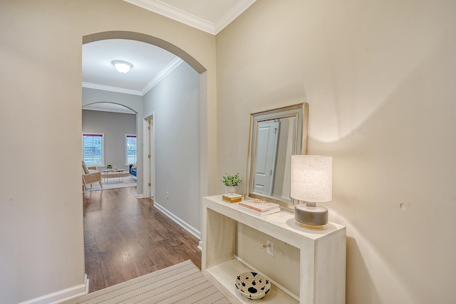 corridor with dark hardwood / wood-style floors and ornamental molding