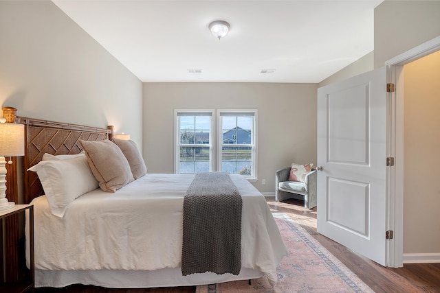 bedroom with hardwood / wood-style flooring