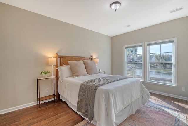 bedroom featuring dark hardwood / wood-style floors