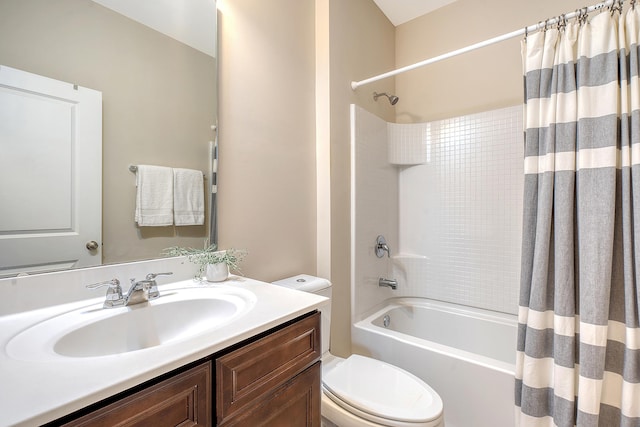 full bathroom featuring vanity, toilet, and shower / tub combo