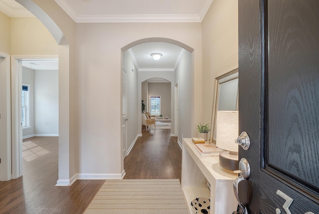 hallway with ornamental molding and dark wood-type flooring