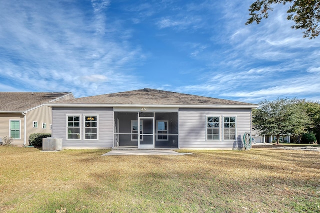 back of house featuring a yard, central AC, a patio area, and a sunroom