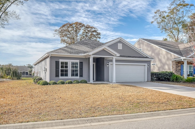 view of front of home featuring a front yard and a garage