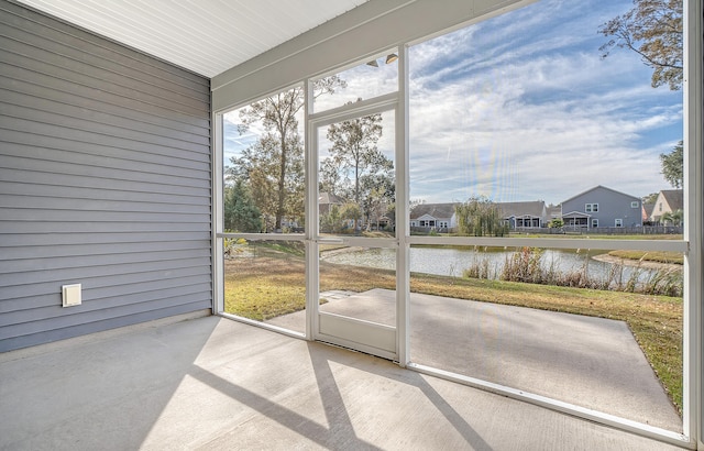 sunroom with a water view