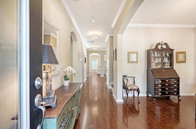 corridor featuring dark hardwood / wood-style floors and ornamental molding