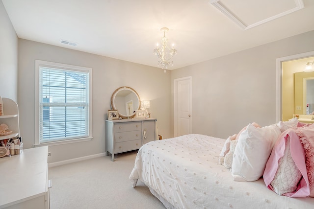 carpeted bedroom featuring a notable chandelier