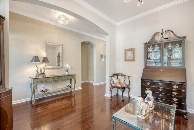 living area with ornamental molding and dark hardwood / wood-style flooring