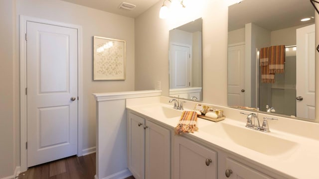 136 Yarrow Way, Moncks Corner, SC 29461 - bathroom featuring double vanity, wood finished floors, a shower with curtain, and baseboards