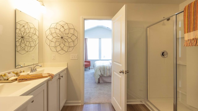 136 Yarrow Way, Moncks Corner, SC 29461 - bathroom featuring vanity, connected bathroom, wood finished floors, a shower stall, and baseboards