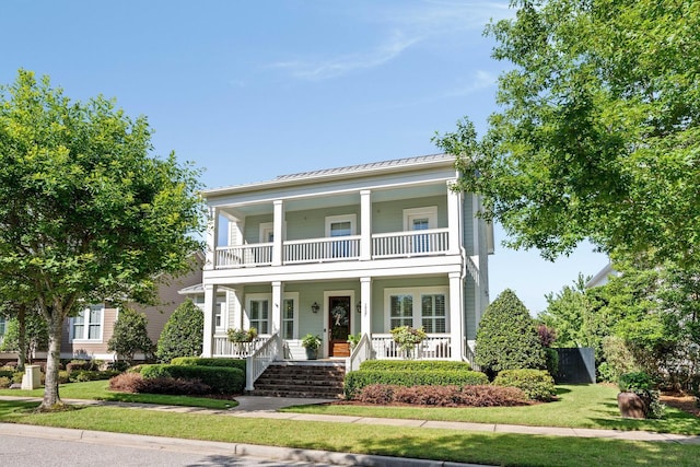1527 Wando View St, Charleston, SC 29492 - greek revival house with a porch, a balcony, a standing seam roof, metal roof, and a front lawn