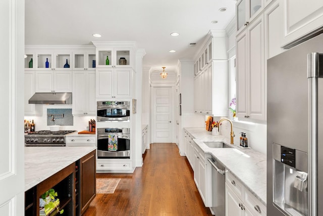 1527 Wando View St, Charleston, SC 29492 - kitchen with stainless steel appliances, a sink, under cabinet range hood, white cabinets, and recessed lighting