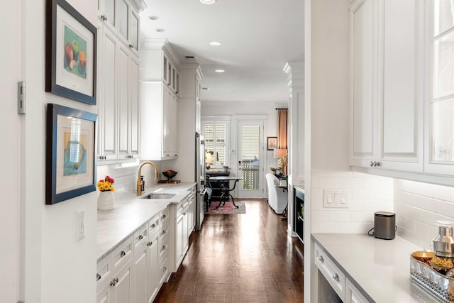 1527 Wando View St, Charleston, SC 29492 - kitchen featuring a sink, decorative backsplash, freestanding refrigerator, white cabinets, and recessed lighting