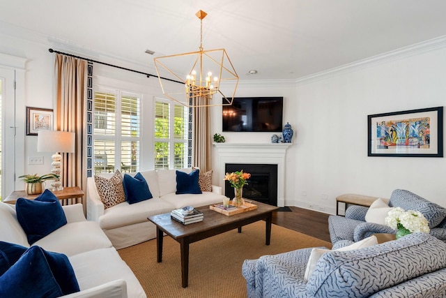 1527 Wando View St, Charleston, SC 29492 - living room featuring ornamental molding, a chandelier, wood finished floors, a fireplace with flush hearth, and baseboards