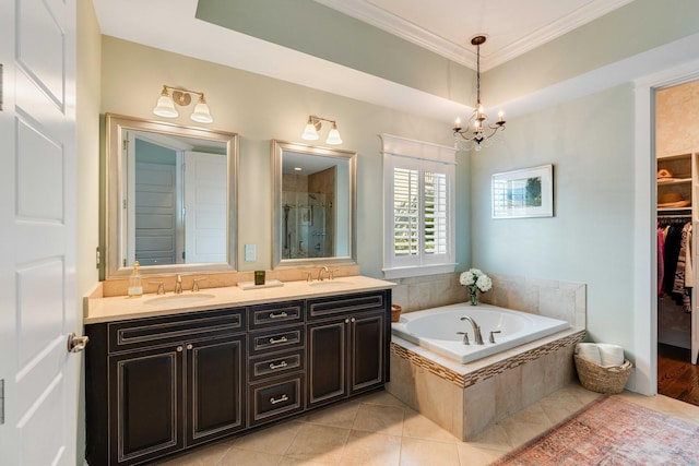 1527 Wando View St, Charleston, SC 29492 - bathroom featuring a garden tub, a spacious closet, a chandelier, a stall shower, and crown molding