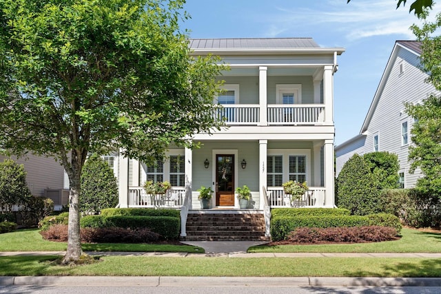 1527 Wando View St, Charleston, SC 29492 - view of front of property featuring covered porch, a balcony, metal roof, and a standing seam roof