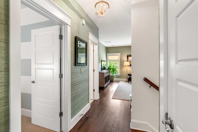 1527 Wando View St, Charleston, SC 29492 - corridor with baseboards, dark wood finished floors, wallpapered walls, and a chandelier