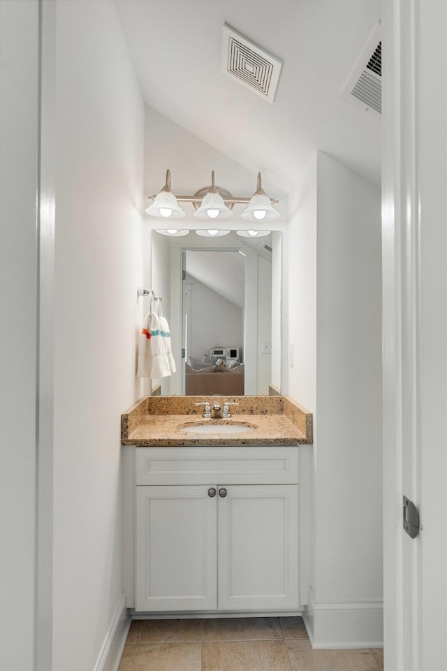 1527 Wando View St, Charleston, SC 29492 - bathroom featuring vaulted ceiling, vanity, baseboards, and tile patterned floors